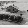 Every available space for parking is used by skiers on weekends at Clinton Gilbert's farm. The house is about 8 years old; purchased by Gilbert in 1929. He has about 150 acres, mainly a dairy farm with 23 cows. He also makes about 100 gallons of maple