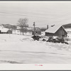 Every available space for parking is used by skiers on weekends at Clinton Gilbert's farm. The house is about 8 years old; purchased by Gilbert in 1929. He has about 150 acres, mainly a dairy farm with 23 cows. He also makes about 100 gallons of maple