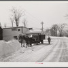 Horses hauling frozen truck to gas station. Woodstock, Vermont