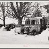 Every available space for parking is used by skiers on weekends at Clinton Gilbert's farm. The house is about 8 years old; purchased by Gilbert in 1929. He has about 150 acres, mainly a dairy farm with 23 cows. He also makes about 100 gallons of maple