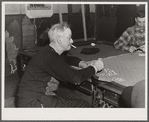Proprietor of pool room and one of the townspeople playing cards on a winter morning. Woodstock, Vermont