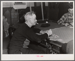 Proprietor of pool room and one of the townspeople playing cards on a winter morning. Woodstock, Vermont
