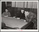 Farmers playing cards in pool room in town on a winter morning. Woodstock, Vermont