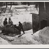 Unloading stove wood from sled woodshed. Woodstock, Vermont