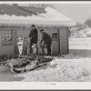 Hauling water in milk cans after pipes have frozen. Clinton Gilbert's farm, Woodstock, Vermont