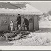 Hauling water in milk cans after pipes have frozen. Clinton Gilbert's farm, Woodstock, Vermont