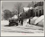 Clearing the banks of snow along main street in center of town. Woodstock, Vermont