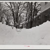 Woodstock, Vermont. Deepest snow in years piled up beside highways and sidewalks on main street