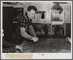 Farmer and townspeople have more leisure time to play cards in pool room during winter months. Woodstock, Vermont