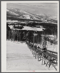 North Conway, New Hampshire, from Cranmore Mountain. Presidential range of White Mountains in distance. Skiers are taken up to the top by the skimobile. Eastern slopes ski territory