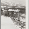 North Conway, New Hampshire, from Cranmore Mountain. Presidential range of White Mountains in distance. Skiers are taken up to the top by the skimobile. Eastern slopes ski territory