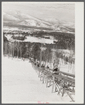 North Conway, New Hampshire, from Cranmore Mountain. Presidential range of White Mountains in distance. Skiers are taken up to the top by the skimobile. Eastern slopes ski territory