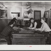 Farmers and townspeople playing cards in pool room on winter morning. Woodstock, Vermont