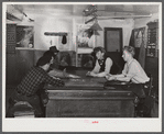 Farmers and townspeople playing cards in pool room on winter morning. Woodstock, Vermont