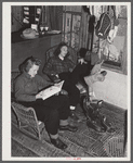 Skiers from Boston, Massachusetts, relaxing in lodge living room at North Conway, New Hampshire