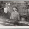 Walter N. Gaylord dripping the boiled-down maple syrup sap to see if it has reached correct consistency for syrup. Making maple syrup on King evaporator. Waitsfield, Mad River Valley, VT. He averages about 150 gallon of syrup annually, this year he tapped