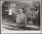 Walter N. Gaylord dripping the boiled-down maple syrup sap to see if it has reached correct consistency for syrup. Making maple syrup on King evaporator. Waitsfield, Mad River Valley, VT. He averages about 150 gallon of syrup annually, this year he tapped