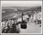 Cable car carrying skiers up Cannon Mountain. Franconia Notch, New Hampshire