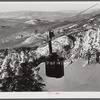 Cable car carrying skiers up Cannon Mountain. Franconia Notch, New Hampshire