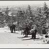Skiers on top of Cannon Mountain. Franconia Notch, New Hampshire