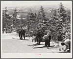 Skiers on top of Cannon Mountain. Franconia Notch, New Hampshire