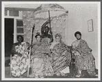 Portrait of civil rights worker Queen Mother Moore with unidentified individuals