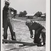 Farmers working outside woodworking shop. Community service center. Faulkner County, Centerville, Arkansas (see general caption)