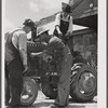 Farmers repairing tractor at community service center. Faulkner County, Centerville, Arkansas (see general caption)