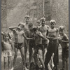 Group of children posing on the street, wet from the fire hydrant spraying