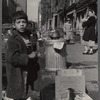 Street scene with young boy and passersby 