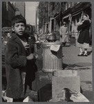 Street scene with young boy and passersby 