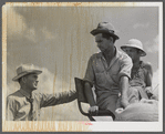 Willie r. Roberts, parish supervisor talking with Otis Coody about his crop, combine purchased thru F.S.A. to harvest crops of low income farmers and F.S.A. borrowers in West Carroll Parish, La