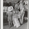 One of project family buying groceries and supplies in their co-op store. Transylvania Project, Louisiana