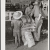 One of project family buying groceries and supplies in their co-op store. Transylvania Project, Louisiana