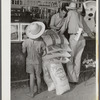 One of project family buying groceries and supplies in their co-op store. Transylvania Project, Louisiana