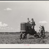 One of the project tractors plowing and discing new land. Transylvania Project, Louisiana