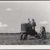 One of the project tractors plowing and discing new land. Transylvania Project, Louisiana