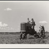 One of the project tractors plowing and discing new land. Transylvania Project, Louisiana