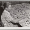 Mrs. Clarence N. Pace's mother-in-law quilting in their home. Transylvania Project, Louisiana