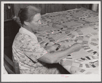 Mrs. Clarence N. Pace's mother-in-law quilting in their home. Transylvania Project, Louisiana