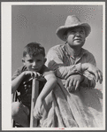 Golus Skipper on the co-op association's binder while threshing Willy Anglin's oats. Transylvania Project, Louisiana