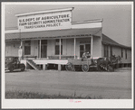 One of project families loading up their wagon with supplies at the cooperative store. Transylvania Project, Louisiana