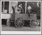 One of the project families loading up their wagon with supplies at the cooperative store. Transylvania Project, Louisiana