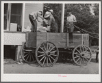 One of the project families loading up their wagon with supplies at the cooperative store. Transylvania Project, Louisiana