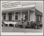 One of project families loading up their wagon with supplies at the cooperative store. Transylvania Project, Louisiana
