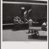 Loading mail into mail car. L&N railroad station, North Florida