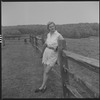 Unidentified woman and fence