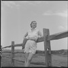 Unidentified woman and fence