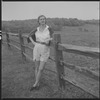 Unidentified woman and fence