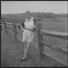Unidentified woman and fence
